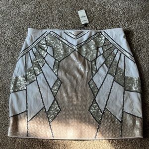 White sequin mini skirt. Size: MED. Never been worn. Tags attached.